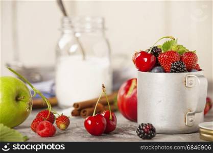 Ingredients for making berry jam on rustic background. Ingredients for making berry jam