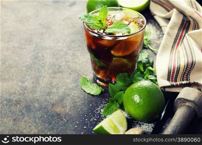 Ingredients for making mojitos (ice cubes, mint leaves, sugar and lime on rustic background)