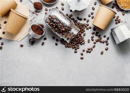 Ingredients for making moka coffee. Moka pot with coffee beans and ingredients on grey background. Coffee making concept. Flat Lay. Ingredients for making coffee flat lay