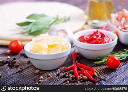 ingredients for pizza on the wooden table