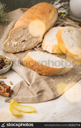 Ingredients for preparing spanish torrijas, french toasts or traditional Portuguese rabanadas for Christmas. Typical sweet food for Christmas made with slices of bread, eggs, cinnamon, cardamom, anise star, milk and lemon peel