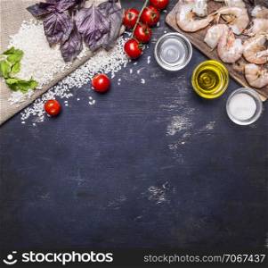 Ingredients for risotto with prawns, vegetables, spices, white wine border, place for text on wooden rustic background top view