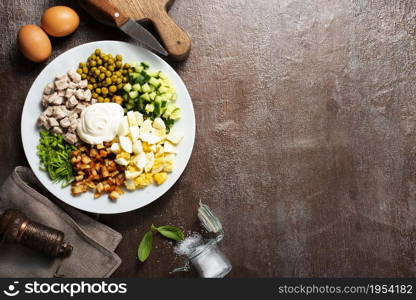 Ingredients for salad in transparent plates on dark background. Ingredients for salad in transparent plates.