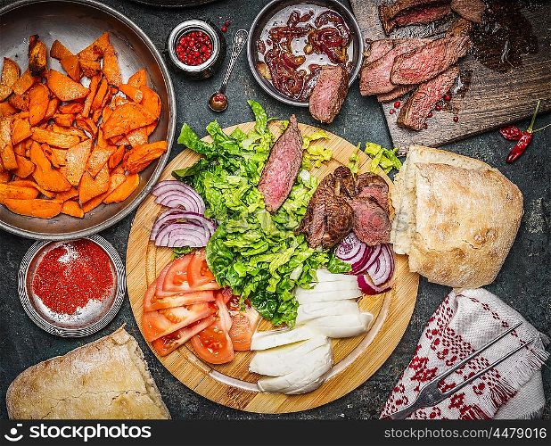 Ingredients for Sandwich making: roasted meat, vegetables and sweet potatoes, top view