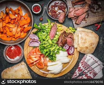 Ingredients for Sandwich making: roasted meat, vegetables and sweet potatoes, top view