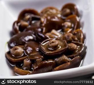 Ingredients for sushi on black plate in dark wooden background