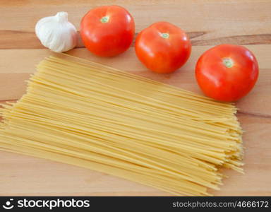 Ingredients to make a delicious plate of pasta with tomato