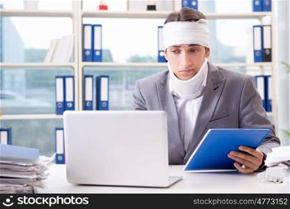 Injured businessman working in the office