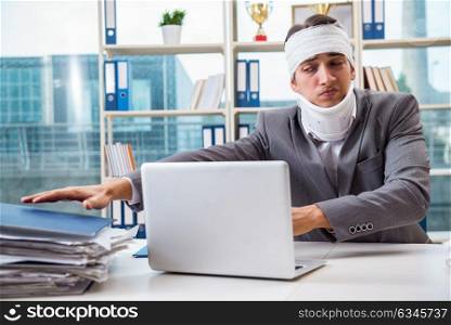 Injured businessman working in the office