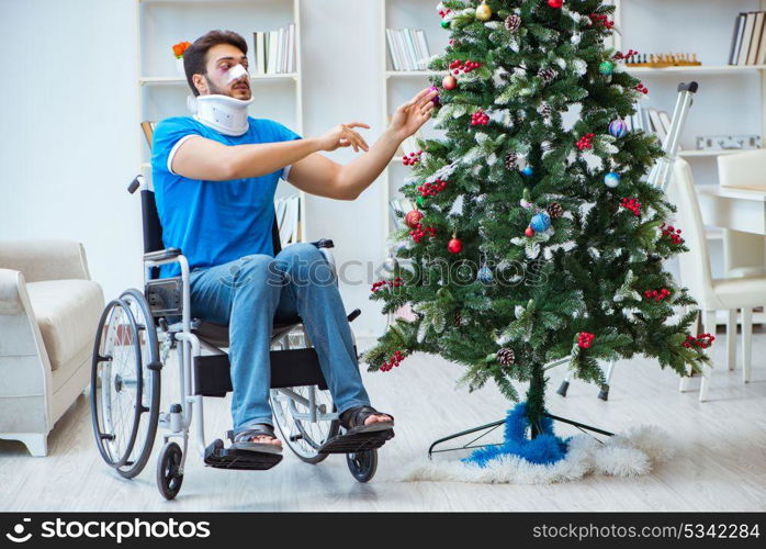 Injured disabled man celebrating christmas at home