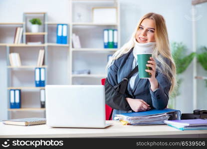 Injured female employee working in the office