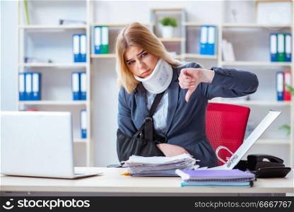 Injured female employee working in the office