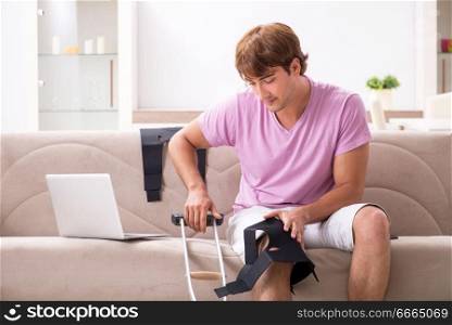 Injured man recovering at home from sports injury