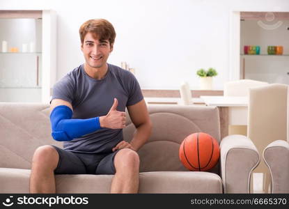 Injured man recovering at home from sports injury