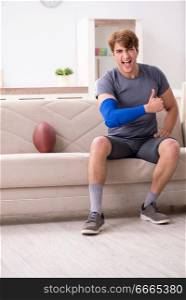Injured man recovering at home from sports injury