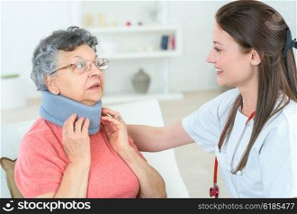 Injured old lady wearing an neck brace
