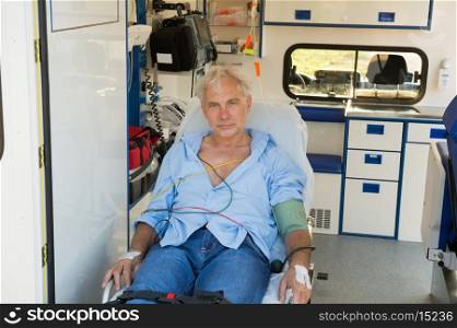 Injured senior man sitting on stretcher in ambulance car