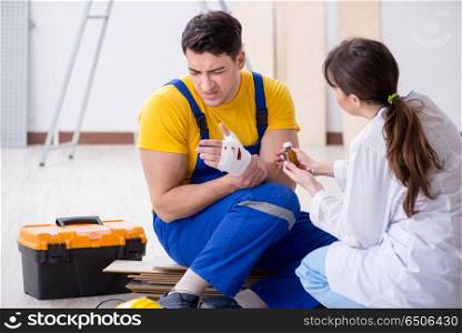 Injured worker being assisted by doctor