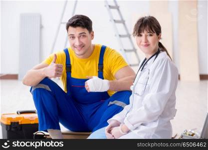 Injured worker being assisted by doctor