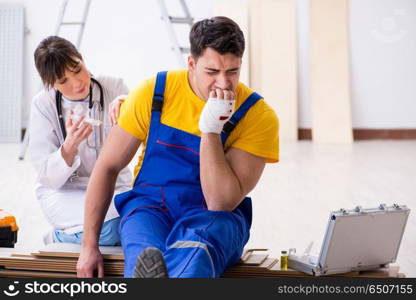 Injured worker being assisted by doctor