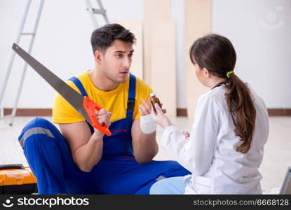 Injured worker being assisted by doctor