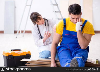 Injured worker being assisted by doctor