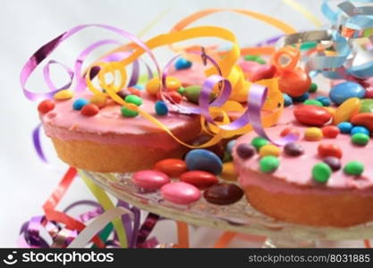 ink glaced cupcakes with colored sprinkles - Childrens party
