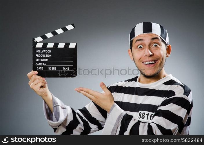 Inmate with movie clapper board