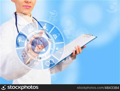 Innovation in modern medicine. Close up of woman doctor touching icon of media screen