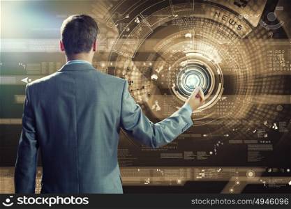 Innovation technologies. Back view of businessman touching icon of media screen