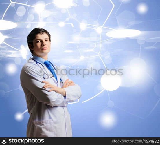 Innovation technologies. Image of young thoughtful doctor looking at media screen