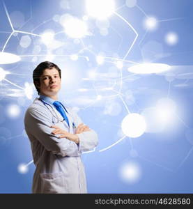 Innovation technologies. Image of young thoughtful doctor looking at media screen