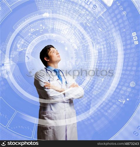 Innovation technologies. Image of young thoughtful doctor looking at media screen