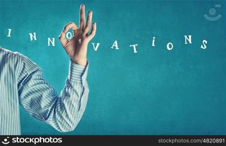 Innovations concept. Word innovations on color background and ok gesture