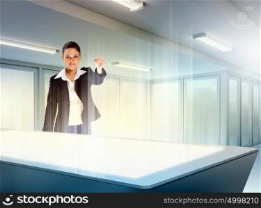 Innovations in business. Image of young businesswoman clicking icon on high-tech picture