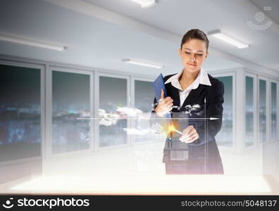 Innovations in business. Image of young businesswoman clicking icon on high-tech picture