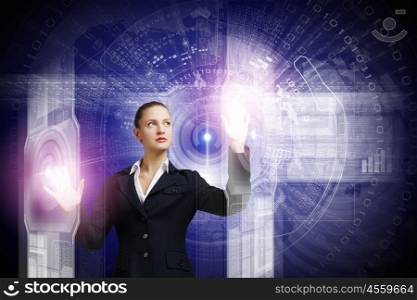Innovative technologies. Attractive businesswoman touching icon of media screen