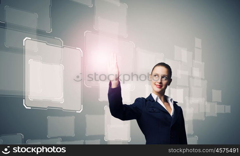 Innovative technologies. Attractive businesswoman touching icon of media screen