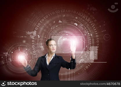 Innovative technologies. Attractive businesswoman touching icon of media screen