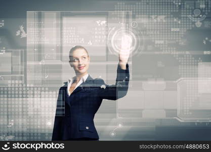 Innovative technologies. Attractive businesswoman touching icon of media screen