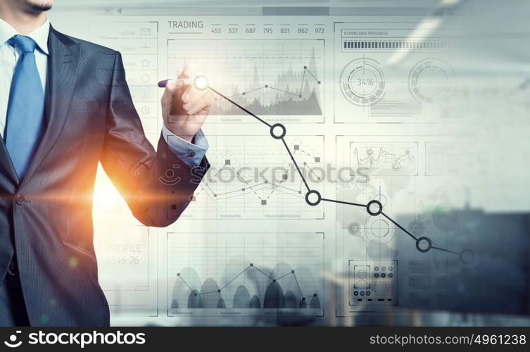 Innovative technologies for business. Businessman hand drawing increasing graph on media screen