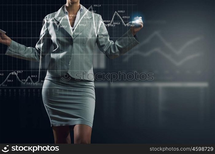 Innovative technologies for your business. Hand of businesswoman drawing virtual infographs on media screen