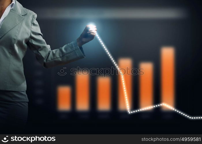 Innovative technologies for your business. Hand of businesswoman drawing virtual infographs on media screen