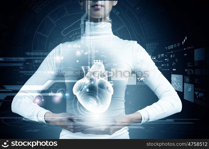 Innovative technologies in medicine. Close up of young woman body and digital images of heart