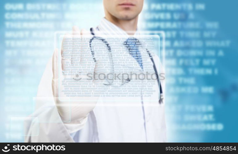 Innovative technologies in medicine. Unrecognizable male doctor with stethoscope working with virtual screen panel