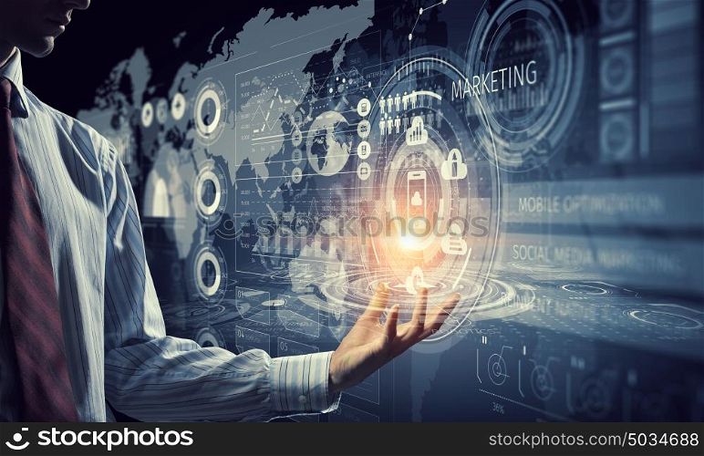 Innovative technologies in use. Close up of businessman hand presenting digital market graphs