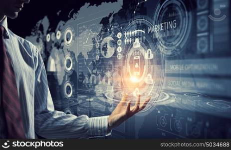 Innovative technologies in use. Close up of businessman hand presenting digital market graphs