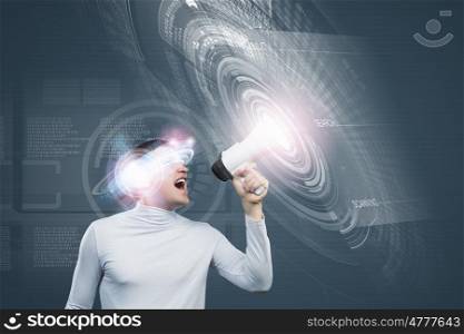 Innovative technologies. Young handsome man screaming in megaphone. Media concept