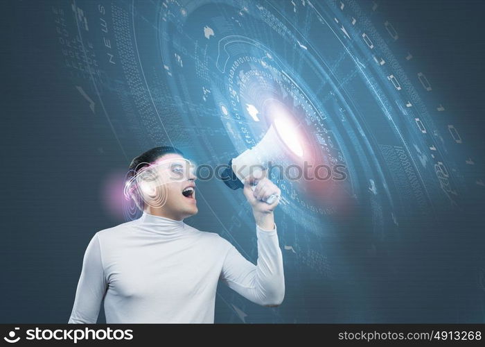 Innovative technologies. Young handsome man screaming in megaphone. Media concept