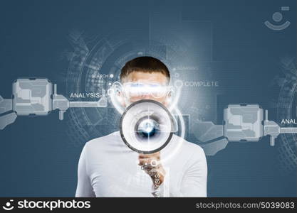 Innovative technologies. Young handsome man screaming in megaphone. Media concept